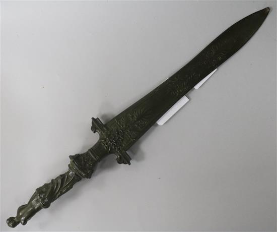 A 19th century bronze letter opener with figural torso handle 13in.